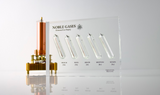 Close-up of a noble gas display made of acrylic. The display features several sections, each containing a different noble gas in its inert, gaseous form, with clear labels identifying each gas. 