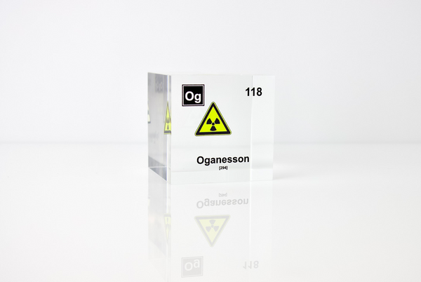 Clear acrylic cube displaying an Oganesson element (Atomic Number 118) embedded within, offering a scientific presentation for collectors and science enthusiasts.