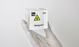 Clear acrylic cube displaying an Oganesson element (Atomic Number 118) embedded within, offering a scientific presentation for collectors and science enthusiasts.