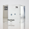 Piece of Osmium encased in a clear acrylic cube, with the element's name, atomic number, and properties displayed as on the periodic table for a sleek, educational display.