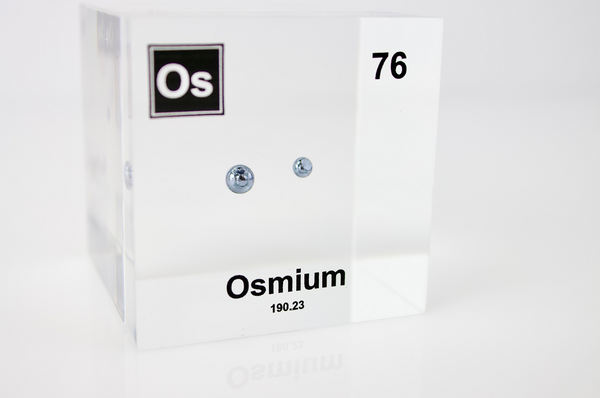 Piece of Osmium encased in a clear acrylic cube, with the element's name, atomic number, and properties displayed as on the periodic table for a sleek, educational display.