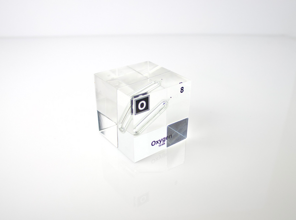 Clear acrylic cube encasing an Oxygen ampule with its atomic number 8. Ideal for display in educational settings, scientific collections, or as a decorative piece.