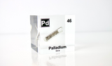 Clear acrylic cube displaying a Palladium element (Atomic Number 46) embedded within, offering a scientific presentation for collectors and science enthusiasts.
