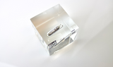 Clear acrylic cube displaying a Palladium element (Atomic Number 46) embedded within, offering a scientific presentation for collectors and science enthusiasts.