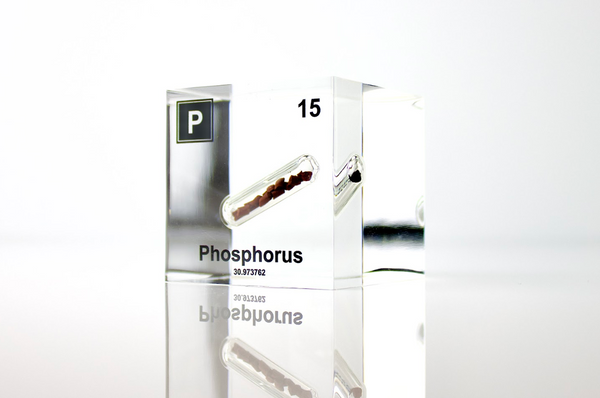 Clear acrylic cube displaying a Phosphorus element (Atomic Number 15) embedded within, offering a scientific presentation for collectors and science enthusiasts.