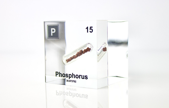 Clear acrylic cube displaying a Phosphorus element (Atomic Number 15) embedded within, offering a scientific presentation for collectors and science enthusiasts.