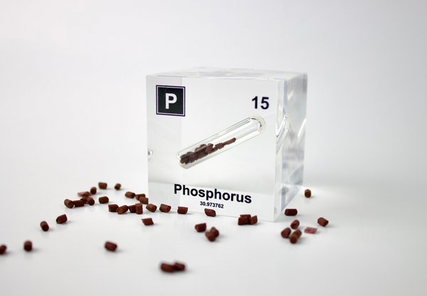 Clear acrylic cube displaying a Phosphorus element (Atomic Number 15) embedded within, offering a scientific presentation for collectors and science enthusiasts.