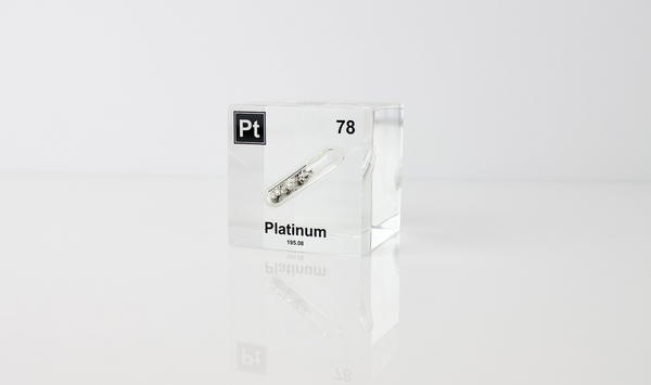 Clear acrylic cube displaying a Platinum element (Atomic Number 78) embedded within, offering a scientific presentation for collectors and science enthusiasts.