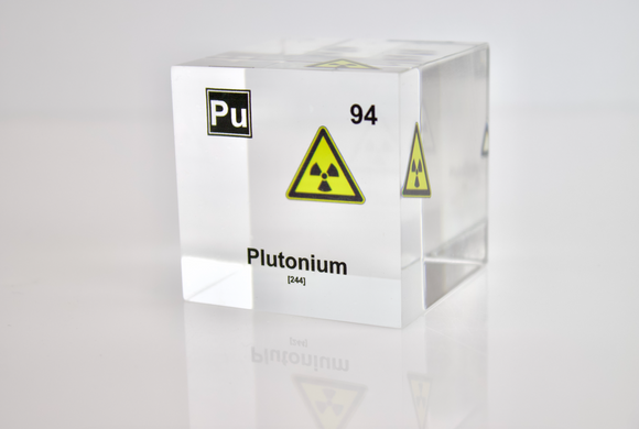 Clear acrylic cube displaying a Plutonium element (Atomic Number 94) embedded within, offering a scientific presentation for collectors and science enthusiasts.