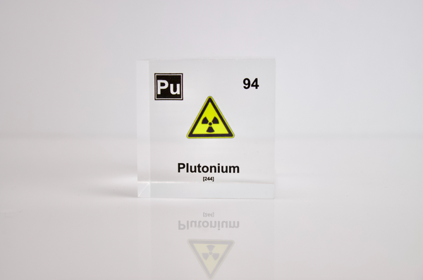 Clear acrylic cube displaying a Plutonium element (Atomic Number 94) embedded within, offering a scientific presentation for collectors and science enthusiasts.