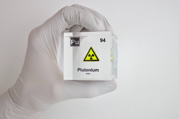 Clear acrylic cube displaying a Plutonium element (Atomic Number 94) embedded within, offering a scientific presentation for collectors and science enthusiasts.