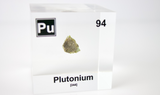 Clear acrylic cube displaying a Plutonium element (Atomic Number 94) embedded within, offering a scientific presentation for collectors and science enthusiasts.
