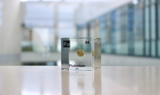 Clear acrylic cube displaying a Plutonium element (Atomic Number 94) embedded within, offering a scientific presentation for collectors and science enthusiasts.