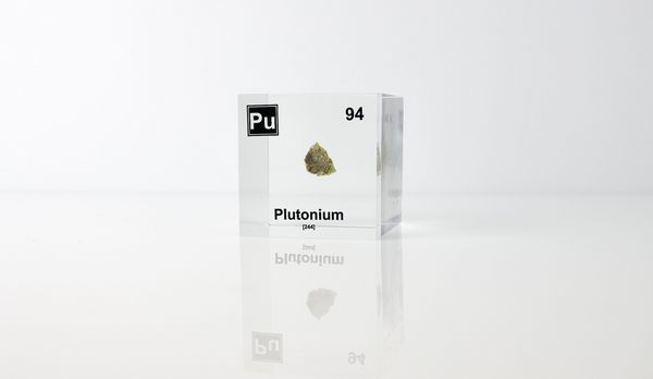 Clear acrylic cube displaying a Plutonium element (Atomic Number 94) embedded within, offering a scientific presentation for collectors and science enthusiasts.