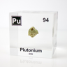 Clear acrylic cube displaying a Plutonium element (Atomic Number 94) embedded within, offering a scientific presentation for collectors and science enthusiasts.