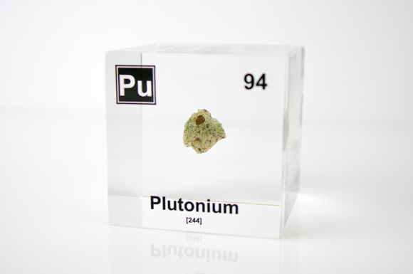 Clear acrylic cube displaying a Plutonium element (Atomic Number 94) embedded within, offering a scientific presentation for collectors and science enthusiasts.