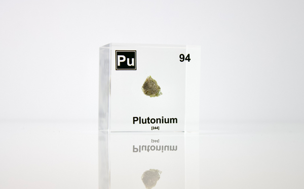 Clear acrylic cube displaying a Plutonium element (Atomic Number 94) embedded within, offering a scientific presentation for collectors and science enthusiasts.