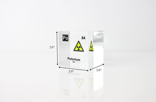 Clear acrylic cube displaying a Polonium element (Atomic Number 84) embedded within, offering a scientific presentation for collectors and science enthusiasts.