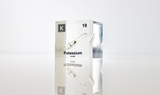 Clear acrylic cube displaying a Potassium element (Atomic Number 19) embedded within, offering a scientific presentation for collectors and science enthusiasts.