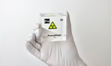 Clear acrylic cube displaying a Promethium element (Atomic Number 61) embedded within, offering a scientific presentation for collectors and science enthusiasts.