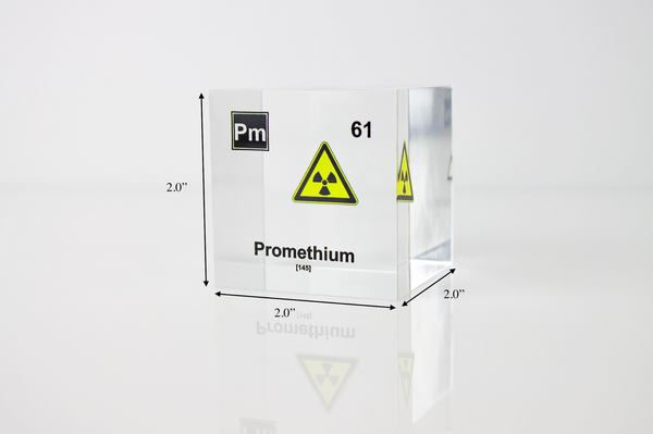 Clear acrylic cube displaying a Promethium element (Atomic Number 61) embedded within, offering a scientific presentation for collectors and science enthusiasts.