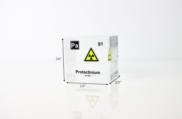 Clear acrylic cube displaying a Protactinium element (Atomic Number 91) embedded within, offering a scientific presentation for collectors and science enthusiasts.