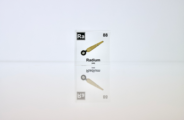 Clear acrylic cube displaying a Radium element (Atomic Number 88) embedded within, offering a scientific presentation for collectors and science enthusiasts.