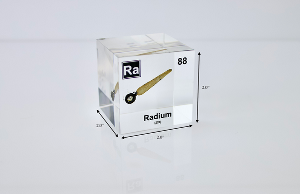 Clear acrylic cube displaying a Radium element (Atomic Number 88) embedded within, offering a scientific presentation for collectors and science enthusiasts.