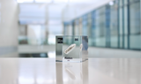 Clear acrylic cube displaying a Radon element (Atomic Number 86) embedded within, offering a scientific presentation for collectors and science enthusiasts.