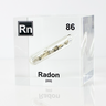 Clear acrylic cube displaying a Radon element (Atomic Number 86) embedded within, offering a scientific presentation for collectors and science enthusiasts.
