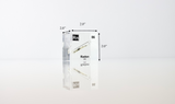 Clear acrylic cube displaying a Radon element (Atomic Number 86) embedded within, offering a scientific presentation for collectors and science enthusiasts.