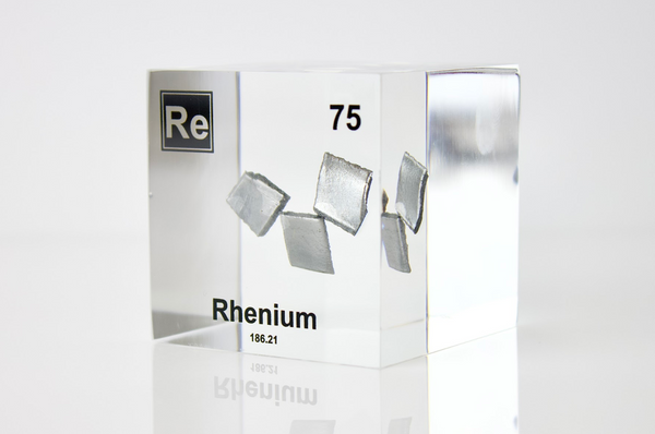 Rhenium element in a clear acrylic cube, featuring its name, atomic number, and properties as shown on the periodic table. A sleek and educational display for collectors and enthusiasts.