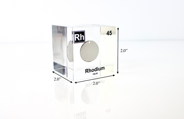 Clear acrylic cube displaying a Rhodium element (Atomic Number 45) embedded within, offering a scientific presentation for collectors and science enthusiasts.