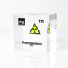Clear acrylic cube displaying a Roentgenium element (Atomic Number 111) embedded within, offering a scientific presentation for collectors and science enthusiasts.