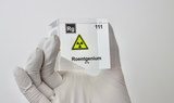 Clear acrylic cube displaying a Roentgenium element (Atomic Number 111) embedded within, offering a scientific presentation for collectors and science enthusiasts.