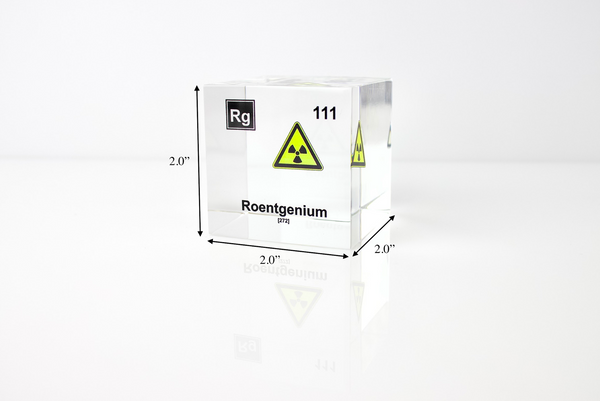 Clear acrylic cube displaying a Roentgenium element (Atomic Number 111) embedded within, offering a scientific presentation for collectors and science enthusiasts.