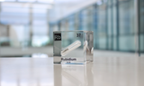 Clear acrylic cube displaying a Rubidium element (Atomic Number 37) embedded within, offering a scientific presentation for collectors and science enthusiasts.