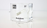 Clear acrylic cube displaying a Rubidium element (Atomic Number 37) embedded within, offering a scientific presentation for collectors and science enthusiasts.