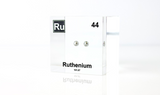 Clear acrylic cube displaying a Ruthenium element (Atomic Number 44) embedded within, offering a scientific presentation for collectors and science enthusiasts.