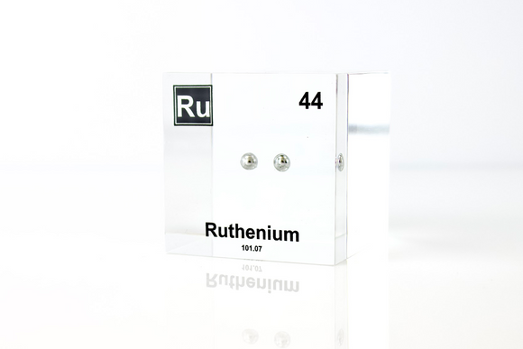 Clear acrylic cube displaying a Ruthenium element (Atomic Number 44) embedded within, offering a scientific presentation for collectors and science enthusiasts.