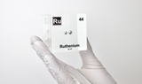 Clear acrylic cube displaying a Ruthenium element (Atomic Number 44) embedded within, offering a scientific presentation for collectors and science enthusiasts.