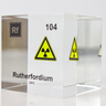 Clear acrylic cube displaying a Rutherfordium element (Atomic Number 104) embedded within, offering a scientific presentation for collectors and science enthusiasts.