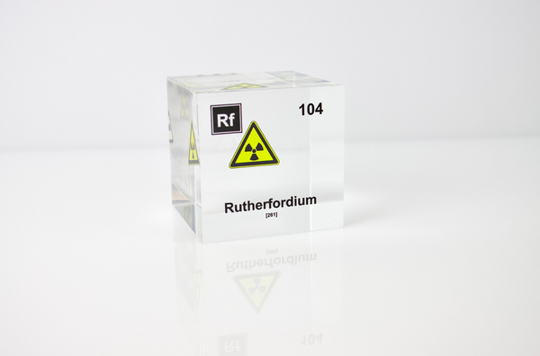 Clear acrylic cube displaying a Rutherfordium element (Atomic Number 104) embedded within, offering a scientific presentation for collectors and science enthusiasts.