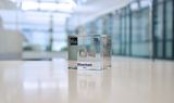 Rhenium element in a clear acrylic cube, featuring its name, atomic number, and properties as shown on the periodic table. A sleek and educational display for collectors and enthusiasts.