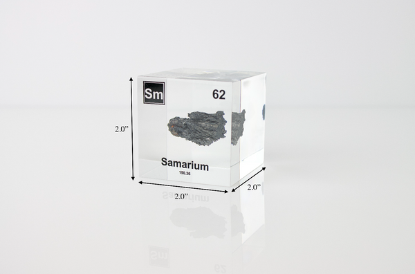 Clear acrylic cube displaying a Samarium element (Atomic Number 62) embedded within, offering a scientific presentation for collectors and science enthusiasts.