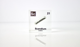 Clear acrylic cube displaying a Scandium element (Atomic Number 21) embedded within, offering a scientific presentation for collectors and science enthusiasts.