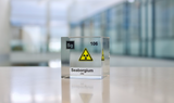 Clear acrylic cube displaying a Seaborgium element (Atomic Number 106) embedded within, offering a scientific presentation for collectors and science enthusiasts.