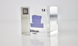 Clear acrylic cube showcasing a Silicon ampule with its atomic number 14. Ideal for use in classrooms, scientific collections, or as a distinctive display piece.