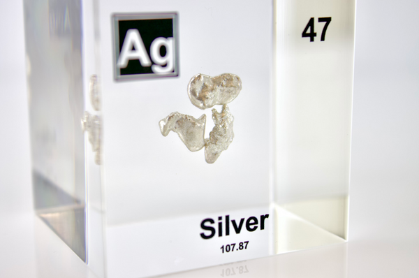 Clear acrylic cube displaying a Silver element (Atomic Number 47) embedded within, offering a scientific presentation for collectors and science enthusiasts.