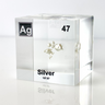 Clear acrylic cube displaying a Silver element (Atomic Number 47) embedded within, offering a scientific presentation for collectors and science enthusiasts.